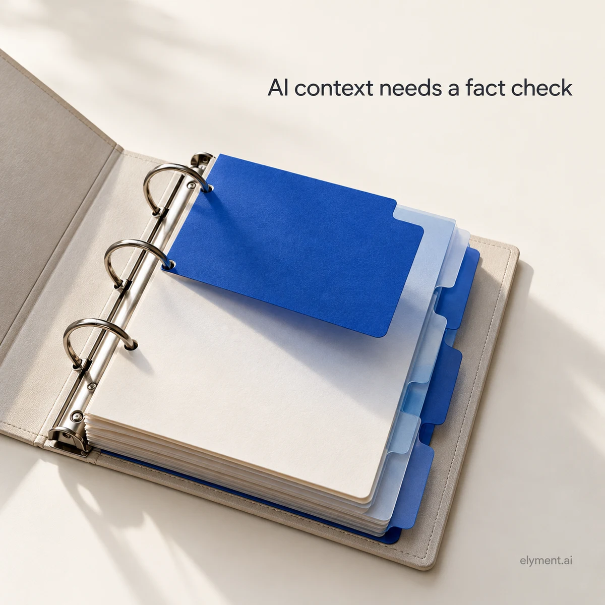 Conceptual ivory ring binder with cobalt index cards, illustrating the need to check and update business facts retained by AI.